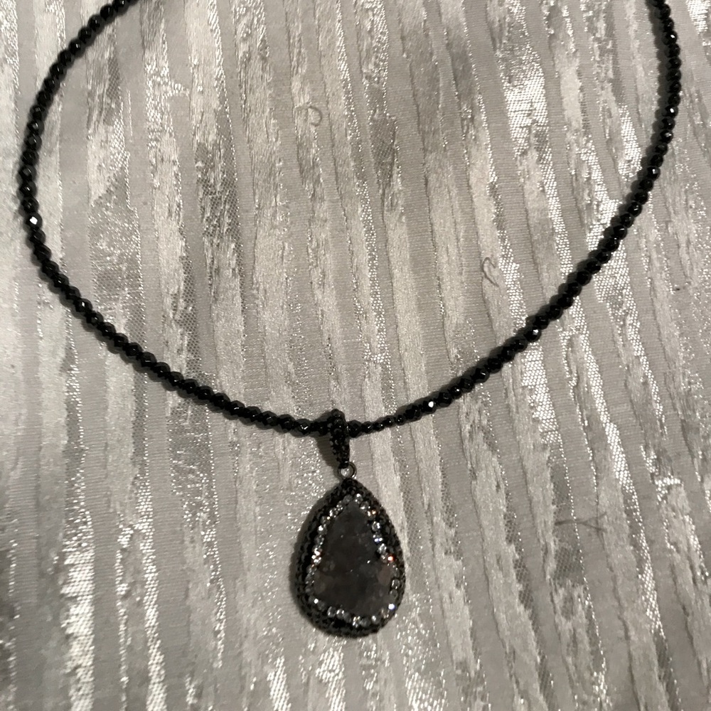 A brand new necklace with a crystal pendant